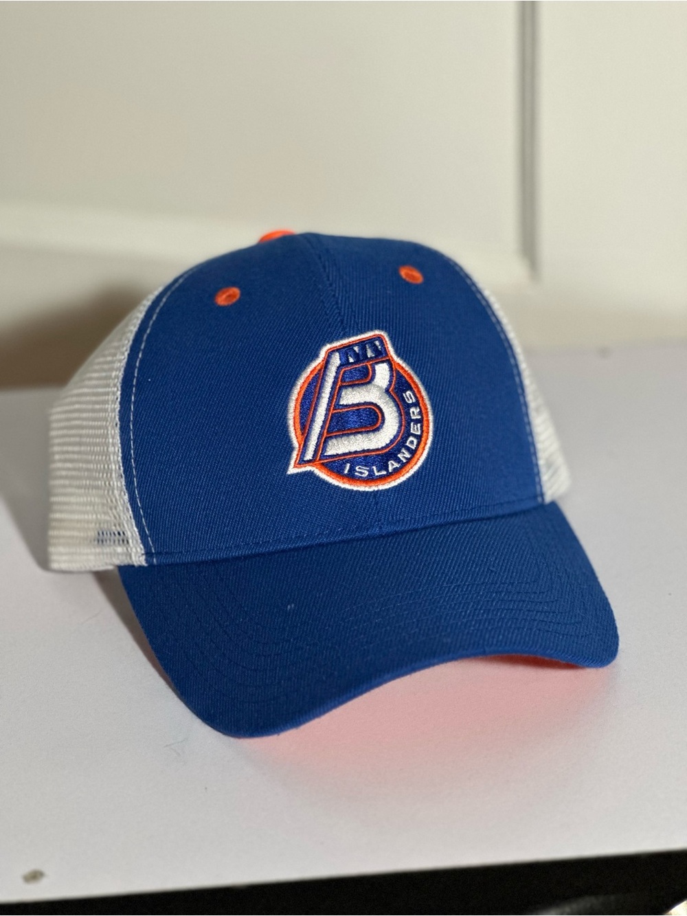 Blue and White Trucker Hat with Orange Accents - Islanders Logo
